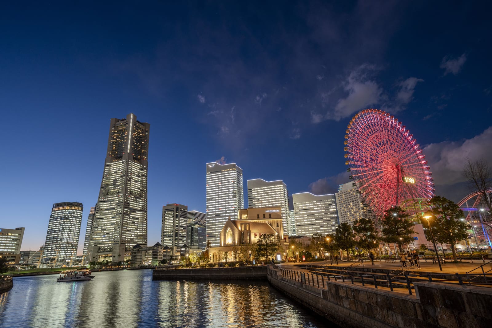 The Minato Mirai skyline at dusk, with Landmark Tower and the Cosmo Clock Ferris wheel